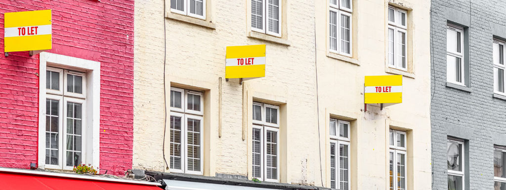 Row of houses with To Let signs