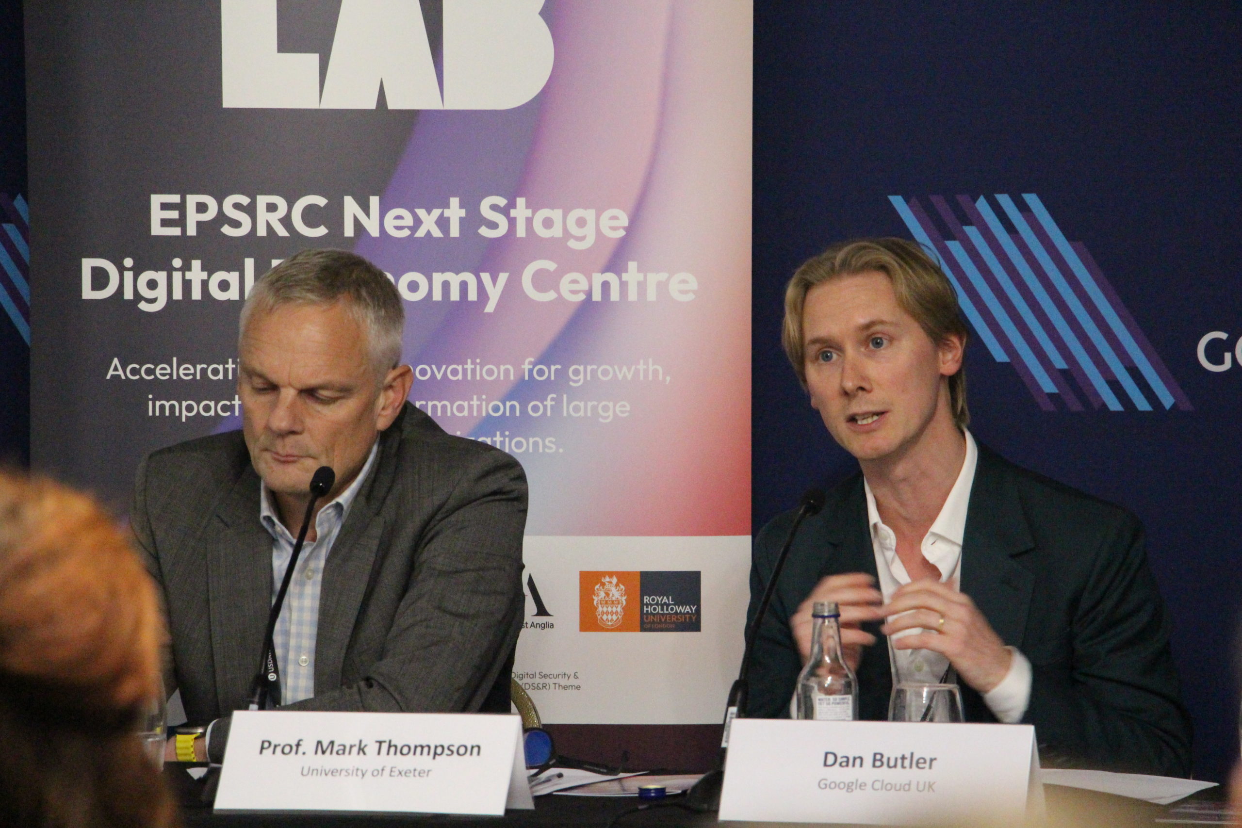 Dan Butler from Google Cloud UK gestures as he speaks at a panel event.